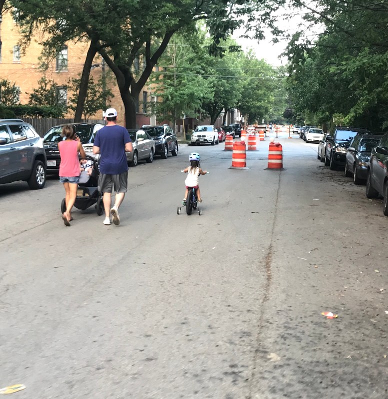 Parents pushing babies and tots riding bikes in the roadway: good signs that a Slow Street is working as intended. Photo: John Greenfield