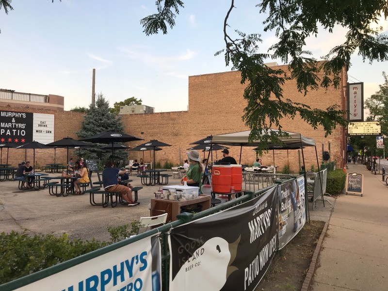 Martyr's, a music venue in North Center that can't currently host shows, has teamed up with the bar Murphy's Bleachers to offer food and drink service in a parking lot. Photo: John Greenfield