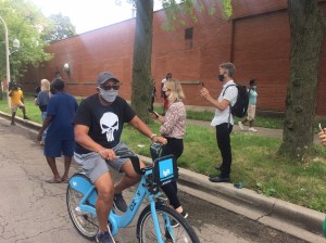 Rodents beware: Squirrel attack survivor Alderman Howard Brookins Jr., wearing a "Punisher" t-shirt, rides  a Divvy at today's presser. Photo: James Porter