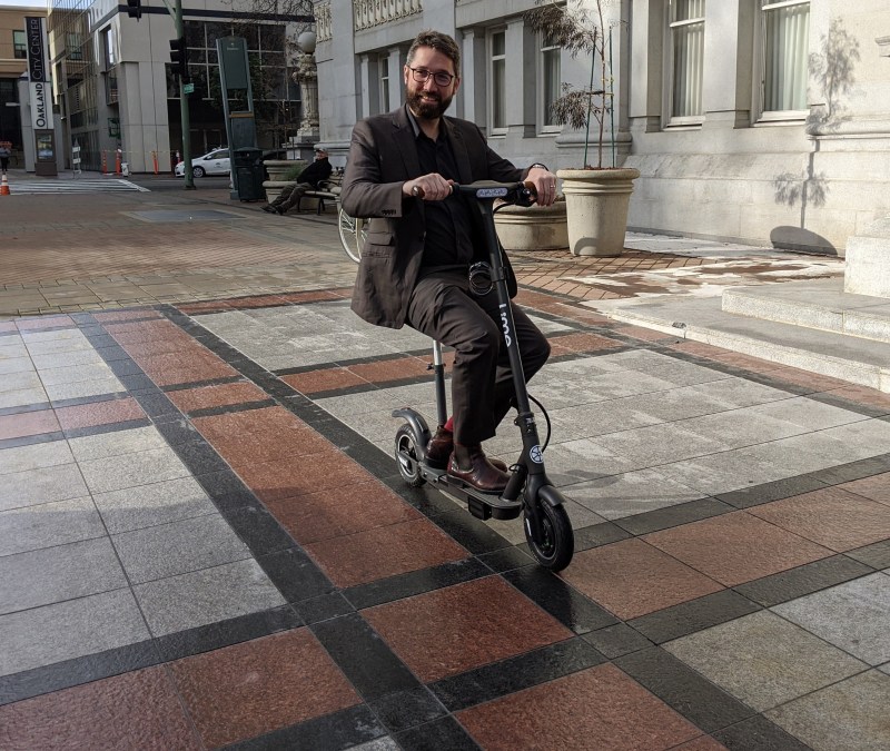 Oakland spokesperson Sean Maher test-rides a seated scooter. Photo: Roger Rudick, Streetsblog San Francisco