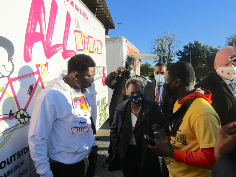 Lightfoot talks with ride organizer Maurice "Pha'Tal" Perkins, left. Photo: Igor Studenkov