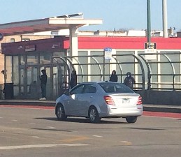 Waiting for the 79th Street bus at the Red Line station. Photo: James Porter