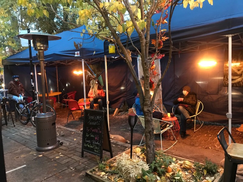 Heated outdoor seating in the parking lane at Rogers Park Social cocktail bar. Photo: Jonathan Roth