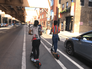 Riding scooters on Lake Street. Photo: John Greenfield