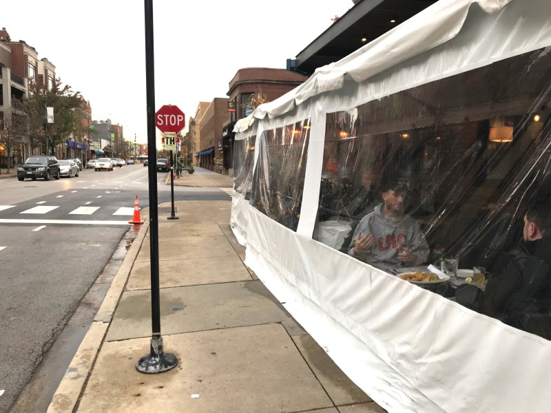 A dining tent on Southport Avenue in Lakeview. While residents are urged to never host non-household members, even in their backyards, it's still legal to drink at bars, many of which feature poorly ventilated shelters. Photo: John Greenfield