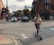 A scooter rider at Belmont/Broadway last September. Photo: John Greenfield