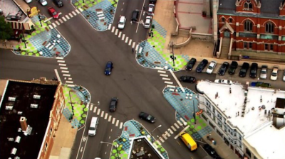 Aerial photo of the Lincoln Hub at Wellington/Southport/Lincoln in Lakeview by traffic reporter Sarah Jindra. Paint-and-post bump-outs made it easier to cross the street, calmed traffic, and created new seating areas.