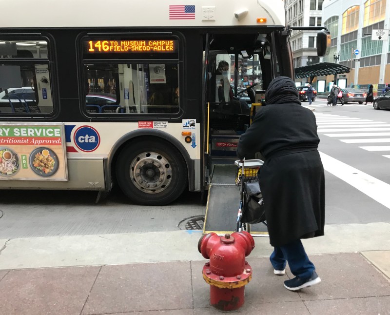 Catching a #146 bus on State Street. Photo: John Greenfield