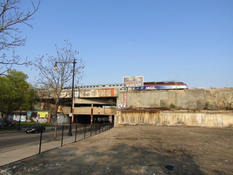 Inbound Rock Island District train rides over the 79th Street bridge, past the site of the future Auburn Park station (foreground.) Photo: Igor Studenkov