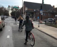 Cyclists riding in dashed bike lanes on Damen Avenue in Lakeview near Liza Whitacre’s "ghost bike" memorial. Photo: John Greenfield