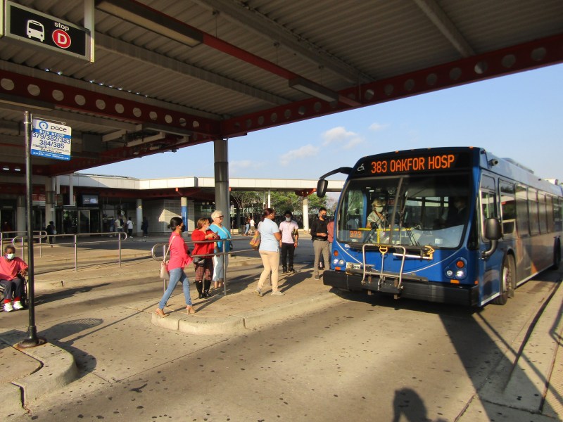 Riders board the Route 383 bus at Midway Airport. The route is returning to its pre-pandemic schedule, with some service changes, on August 8. Photo: Igor Studenkov