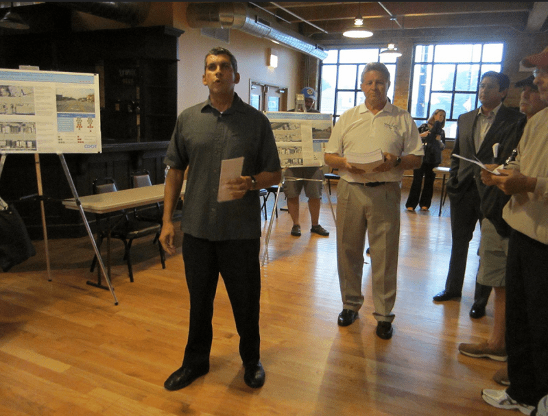 45th Ward aldermanic candidate John Garrido and Gladstone Park Chamber of Commerce president Dave Wians at a 2014 community meeting, holding stack of petitions against the Milwaukee protected bike lane proposal on the Far Northwest Side. Photo: John Greenfield