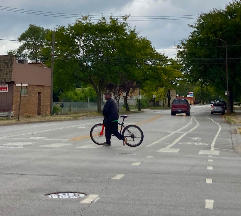 A person with a bike in Chicago's Roseland community. In recent years the city has been building more bikeways on the Far South Side, but the density of bikeways is still much greater in most of the North Side. Photo: John Greenfield
