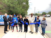 Cutting the ribbon on the new 119th Street protected bike lanes. Left to right: Randy Newfeld and Brandon Goodall from SRAM; Bobby Berry from Friends of the Major Taylor Trail; Biagi, Austen, Taylor; Paul Fitzgerald from Friends of Big Marsh; Rynell. Photo: John Greenfield