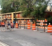 Family crossing California Avenue on Logan Boulevard, where traffic diverters have been set up. Photo: Sharon Hoyer