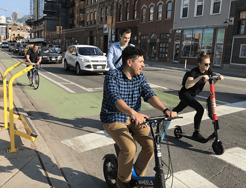 Scooter riders on Milwaukee Avenue in River West during the 2019 pilot. Photo: John Greenfield