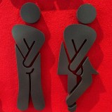 A sign for a gender-neutral bathroom in the Loop. Photo: Eric Allix Rogers