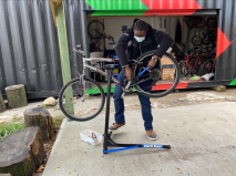 Robert Welch installs a pedal at the North Lawndale Bike Box. Photo: Amber Drea