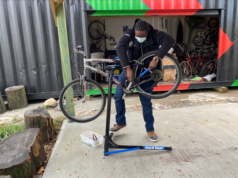Robert Welch installs a pedal at the North Lawndale Bike Box. Photo: Amber Drea