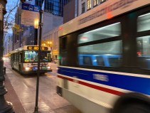 Buses on State Street last night. Streetsblog Chicago is looking into complaints about long waits between CTA buses and trains in recent months. Photo: John Greenfield
