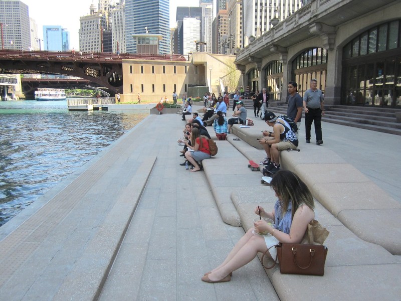 Seating units on the Chicago Riverwalk, photographed soon after the riverwalk opened in summer 2015. The riverwalk is is somewhat "sticky" public space, in that it invites lingering. Photo: John Greenfield