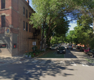 Green bike box pavement markings at Division and Wood, part of the Wood Street Neighborhood Greenway. 1st Ward residents voted to convert the corridor to a one-way northbound street to make room for a two-way protected bike lane. Image: Google Maps