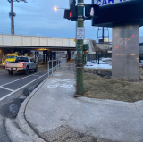Sign and stencil at the northeast corner of Halted/Archer, looking north. The sidewalk railing has been reinstalled closer to the curb to provide more room on the sidewalk for biking. Photo: Twitter user @babygluckling.