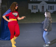 "Little girl, you should wear reflective safety gear so that grownups in cars won't kill you when you walk in the street at night because there are no sidewalks." Image: National Road Safety Foundation, Chicago Auto Show