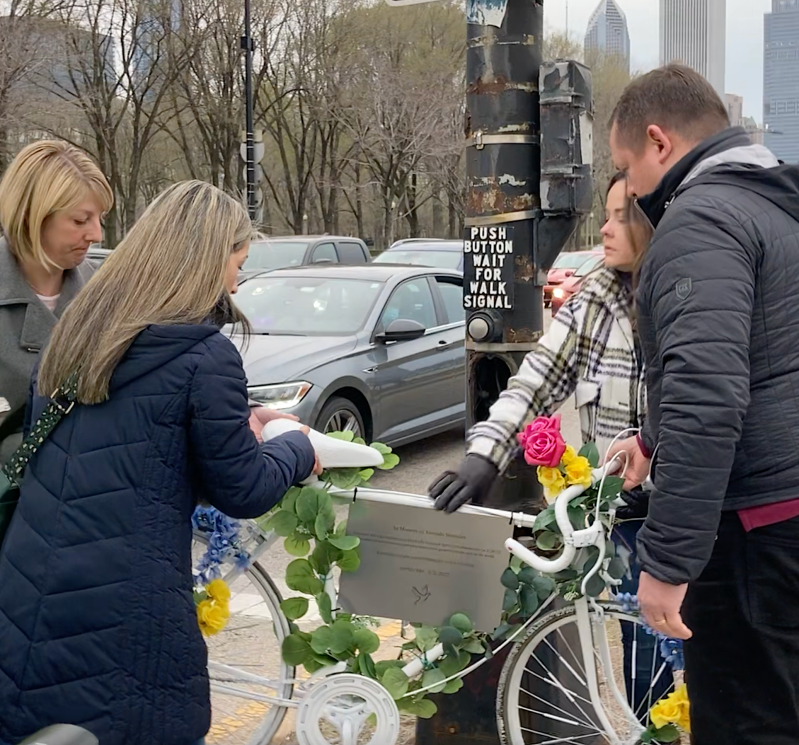 Gerardo Marciales' loved ones install a ghost bike at the intersection where he was killed. Image: John Greenfield