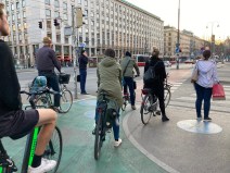 Waiting for a light on a sidewalk-level bike lane in Vienna, which appears to have a seamless network of car-separated bikeways. Photo: John Greenfield