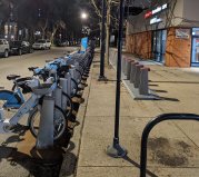 One of the new Divvy charging stations, right, with a traditional station. Photo: Michael Toner