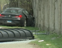 The aftermath of the West Ridge crash: The roof of the bus shelter, and the BMW next to the wall of Rosehill Cemetery. Image: ABC Chicago