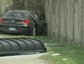 The aftermath of the West Ridge crash: The roof of the bus shelter, and the BMW next to the wall of Rosehill Cemetery. Image: ABC Chicago