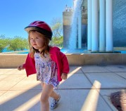 Lily Grace Shambrook by a fountain at McCormick Place during a bike ride on the Lakefront Trail. Photo: Provided