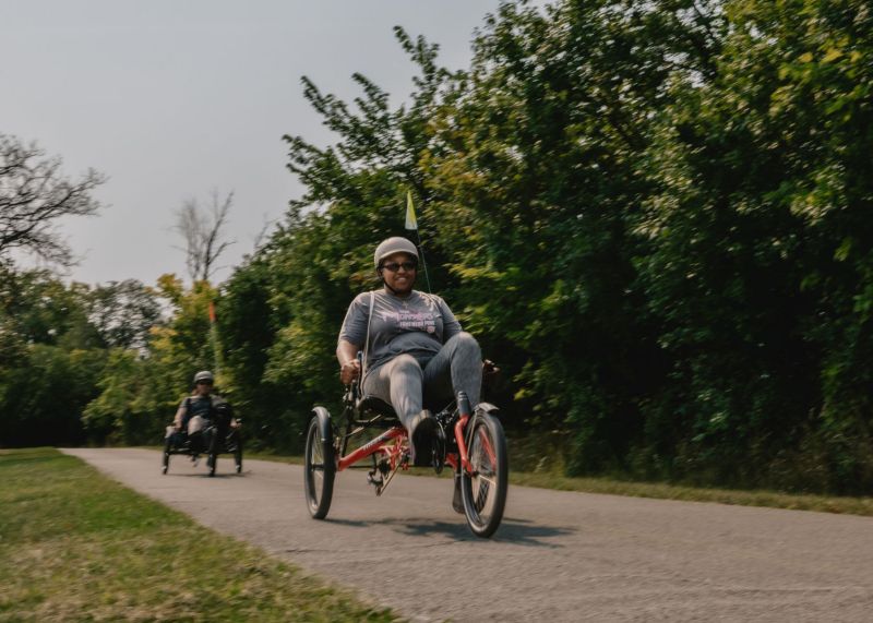 Riding adaptive bikes on a trail. Image via Divvy