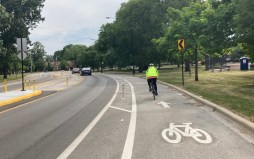 A road diet with bike lanes and pedestrian and bus-boarding islands was recently implemented on Jackson Boulevard in Columbus Park. Martin's ordinance would require CDOT to consider similar accommodations whenever streets are repaved. Photo: John Greenfield
