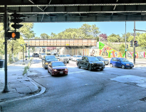 Apple Maps street view of one side of the Kedzie-Belmont intersection showing the lack of room for cycling and deplorable sidewalk conditions.