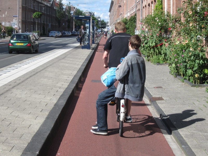 Biking with a friend in Amsterdam. Photo: John Greenfield