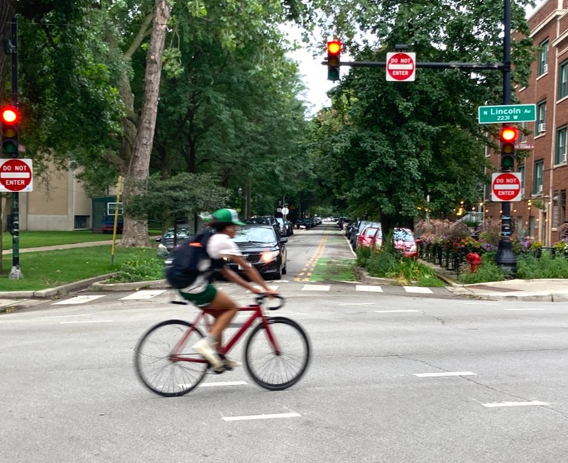 The entrance to the Sunnyside contraflow bike lane at Lincoln Avenue by Welles Park, looking west. Photo: John Greenfield