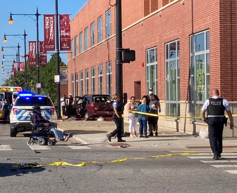 After the driver of this SUV ran a red, another motorist struck his vehicle, sending it careening onto the sidewalk, striking pedestrians before hitting the wall the wall. Photo: John Greenfield